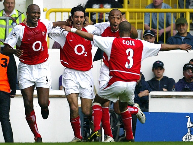 Arsenal's French midfielder Robert Pires celebrates his goal against Tottenham during their Premier League football clash at White Hart Lane in north London, 25 April 2004