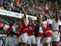 Arsenal players celebrates winning the 2003/2004 Football Premier League after drawing 2-2 with Tottenham in their Premier League clash at White Hart Lane in north London, 25 April 2004