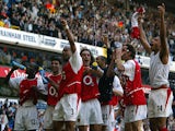 Arsenal players celebrates winning the 2003/2004 Football Premier League after drawing 2-2 with Tottenham in their Premier League clash at White Hart Lane in north London, 25 April 2004