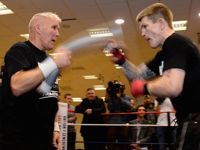 British boxer Ricky Hatton (R) trains with trainer Bob Shannon at the Hatton Health and Fitness gym in Hyde, Manchester, north-west England on November 14, 2012