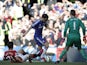 Manchester United's Spanish midfielder Ander Herrera slides to try to block a shot from Chelsea's Spanish midfielder Cesc Fabregas as Manchester United's Spanish goalkeeper David de Gea (R) keeps goal during the English Premier League football match betwe