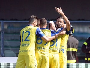 Sergio Pellissier of Chievo Verona is mobbed by team mates after scoring his opening goal during the Serie A match between AC Chievo Verona and Udinese Calcio at Stadio Marc'Antonio Bentegodi on April 19, 2015