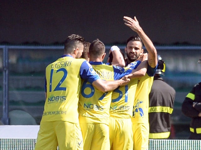 Sergio Pellissier of Chievo Verona is mobbed by team mates after scoring his opening goal during the Serie A match between AC Chievo Verona and Udinese Calcio at Stadio Marc'Antonio Bentegodi on April 19, 2015