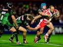 Charlie Sharples of Gloucester evades the tackle of Jack Nowell of Exeter during the European Rugby Challenge Cup semi final match between Gloucester Rugby and Exeter Chiefs at Kingsholm Stadium on April 18, 2015