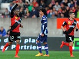 Guingamp's French midfielder Claudio Beauvue celebrates after scoring during the French L1 football match between Guingamp and Evian on April 18, 2015