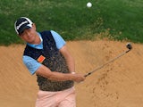 Huang Wen Yi of China plays from the bunker on the 7th hole during day one of the BMW Shanghai Masters golf tournament at the Lake Malaren Golf Club in Shanghai on October 24, 2013