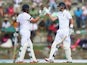 Ian Bell and Joe Root of England bring up their 150 run partnership during day one of the 1st Test match between West Indies and England at the Sir Vivian Richards Stadium on April 13, 2015