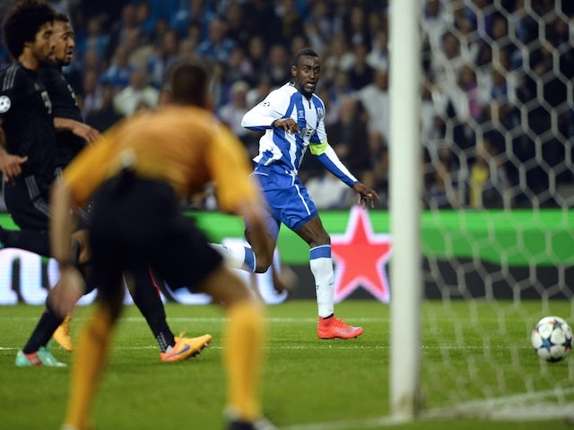 Porto's Colombian forward Jackson Martinez (R) scores a goal during the UEFA Champions League quarter final football match FC Porto vs FC Bayern Munich at the at the Dragao stadium in Porto on April 15, 2015