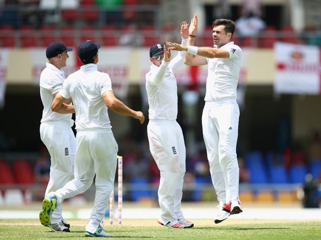 James Anderson of England celebrates taking the wicket of Devon Smith of West Indies during day two of the 1st Test match between West Indies and England at the Sir Vivian Richards Stadium on April 14, 2015