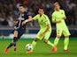 Javier Pastore of PSG is challenged by Sergio Busquets of Barcelona during the UEFA Champions League Quarter Final First Leg match between Paris Saint-Germain and FC Barcelona at Parc des Princes on April 15, 2015