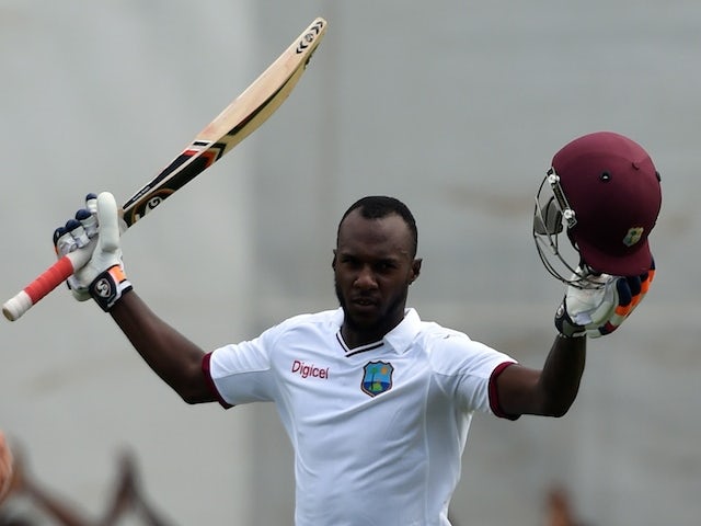 West Indies batsman Jermaine Blackwood celebrates scoring his century on day three of the first test match between West Indies and England at the Sir Vivian Richard Stadium in St John's, Antigua on April 15, 2015