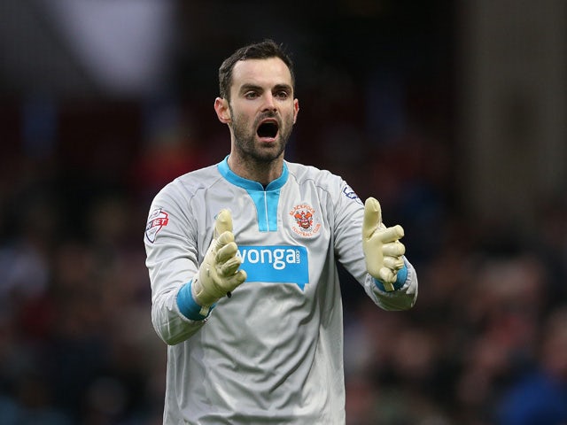 Joe Lewis of Blackpool gesticulates during the FA Cup Third Round Match between Aston Villa and Blackpool at Villa Park on January 4, 2015