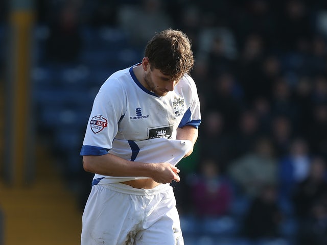 Joe Riley of Bury walks dejectedly from the pitch after being shown a red card by referee David Coote during the Sky Bet League Two match between Bury and Northampton Town at The JD Stadium on March 21, 2015