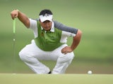 Kiradech Aphibarnrat of Thailand lines up a putt during the final round of the Shenzhen International at Genzon Golf Club on April 19, 2015
