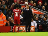 Brendan Rodgers manager of Liverpool shakes hands with Raheem Sterling of Liverpool as he is substituted during the Barclays Premier League match between Liverpool and Newcastle United at Anfield on April 13, 2015