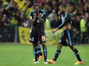 Marseille's players react at the end of the French L1 football match between Nantes and Marseille on April 17, 2015