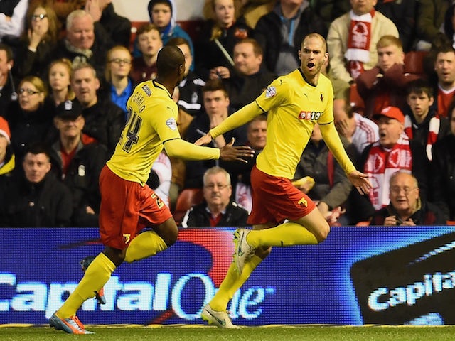 Matthew Connolly of Watford celebrates scoring their second goal with Odion Ighalo of Watford (R) during the Sky Bet Championship match between Nottingham Forest and Watford at City Ground on April 15, 2015