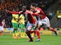 Albert Adomah and George Friend of Middlesbrough celebrate as Alexander Tettey of Norwich City scores their first goal with an own goal during the Sky Bet Championship match between Norwich City and Middlesbrough at Carrow Road on April 17, 2015