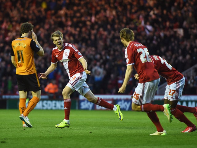 Patrick Bamford of Middlesbrough celebrates with team mates as he scores their second goal during the Sky Bet Championship match between Middlesbrough and Wolverhampton Wanderers at Riverside Stadium on April 14, 2015