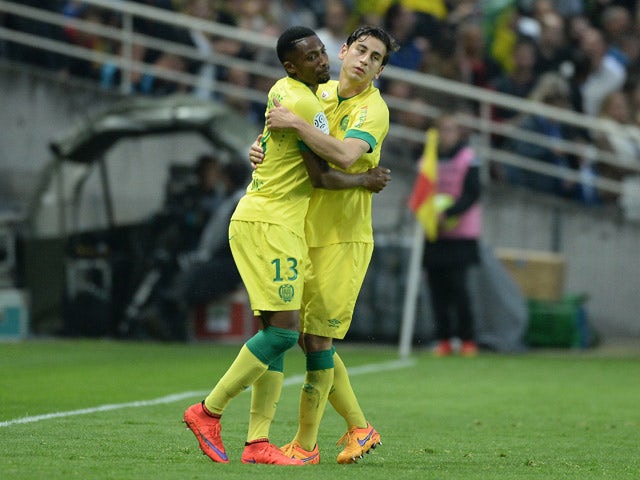 Nantes' Togolese forward Serge Gakpe celebrates with Nantes' US midfielder Alejandro Bedoya after scoring a goal during the French L1 football match between Nantes and Marseille on April 17, 2015