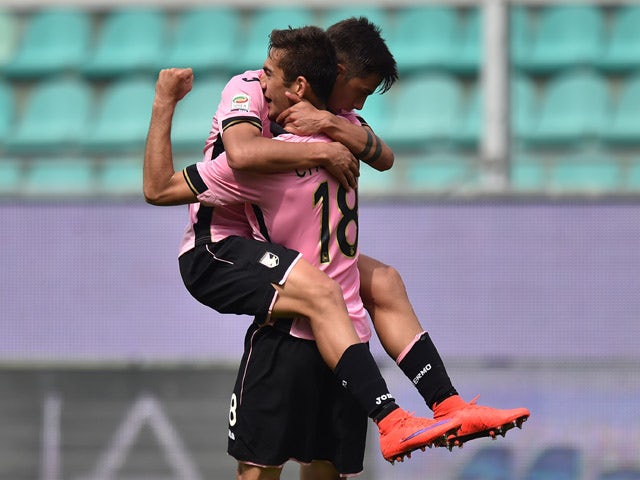 Ivaylo Chochev of Palermo celebrates with Paulo Dybala after scoring his second goal during the Serie A match between US Citta di Palermo and Genoa CFC at Stadio Renzo Barbera on April 19, 2015