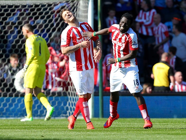 Mame Diouf of Stoke celebrates scoring his team's first goal during the Barclays Premier League match between Stoke City and Southampton at the Britannia Stadium on April 18, 2015