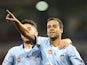 Alex Brosque and Christopher Naumoff of Sydney FC celebrate a goal during the round 26 A-League match between the Newcastle Jets and the Sydney FC at Hunter Stadium on April 17, 2015