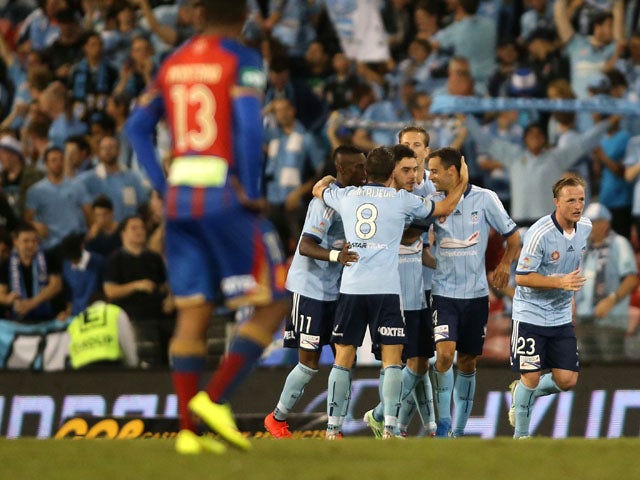 Sydney FC players celebrate a goal during the round 26 A-League match between the Newcastle Jets and the Sydney FC at Hunter Stadium on April 17, 2015