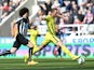 Harry Kane of Spurs is chased down by Fabricio Coloccini of Newcastle United during the Barclays Premier League match between Newcastle United and Tottenham Hotspur at St James' Park on April 19, 2015