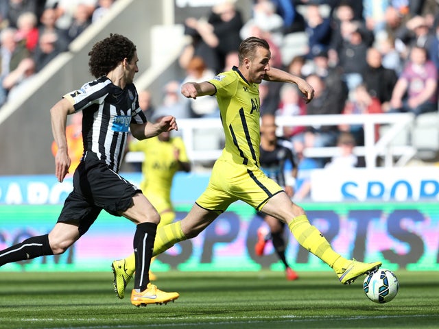 Harry Kane of Spurs is chased down by Fabricio Coloccini of Newcastle United during the Barclays Premier League match between Newcastle United and Tottenham Hotspur at St James' Park on April 19, 2015
