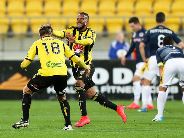 Kenny Cunningham of the Phoenix celebrates his goal with teammate Ben Sigmund during the round 26 A-League match between the Wellington Phoenix and the Central Coast Mariners at Westpac Stadium on April 17, 2015