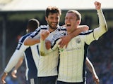 Craig Gardner of West Brom celebrates scoring their second goal with Claudio Yacob of West Brom during the Barclays Premier League match between Crystal Palace and West Bromwich Albion at Selhurst Park on April 18, 2015