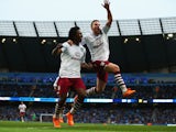 Tom Cleverley of Aston Villa celebrates with goalscorer Carlos Sanchez during the Barclays Premier League match between Manchester City and Aston Villa at Etihad Stadium on April 25, 2015