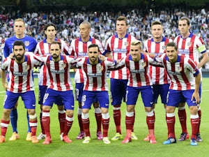 Atletico Madrid's players pose before the UEFA Champions League quarter-finals second leg football match Real Madrid CF vs Club Atletico de Madrid at the Santiago Bernabeu stadium in Madrid on April 22, 2015