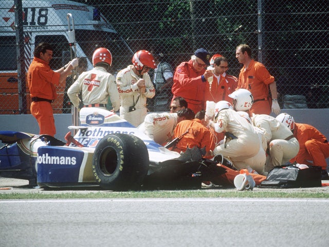 Medical staff surrounds Brazilian Formula One driver Ayrton Senna after his crash during the San Marino Grand Prix on the Imola racetrack 01 May 1994