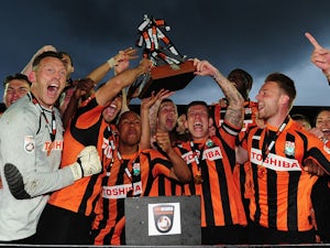The Barnet Team celebrate with the trophy after clinching promotion during the Vanarama Football Conference League match between Barnet and Gateshead at The Hive on April 25, 2015