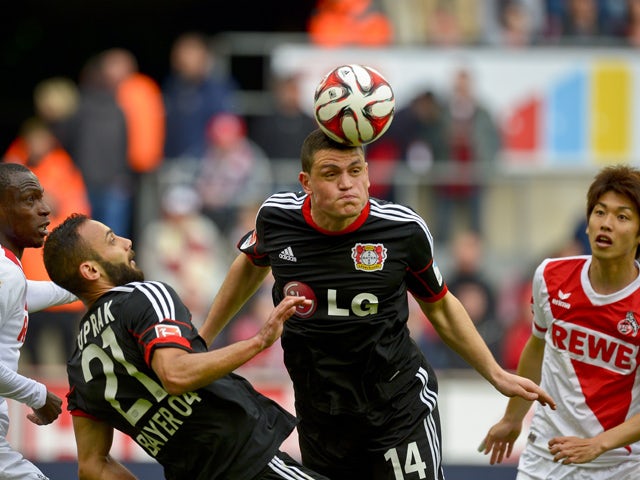 Leverkusen`s Kyriakos Papadopoulos heads the ball during the German first division Bundesliga football match between 1 FC Cologne v Bayer 04 Leverkusen in Cologne, Germany, on April 25, 2015