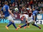 Burnley's English striker Danny Ings has a shot at goal blocked by Leicester City's Polish defender Marcin Wasilewski during the English Premier League football match between Burnley and Leicester at Turf Moor in Burnley, north west England on April 25, 2