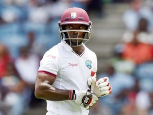West Indies batsman Devon Smith leaves the field after being dimissed off England's bowler Chris Jordan during the second Test match between West Indies and England at the Grenada National Stadium in Saint George's on April 21, 2015