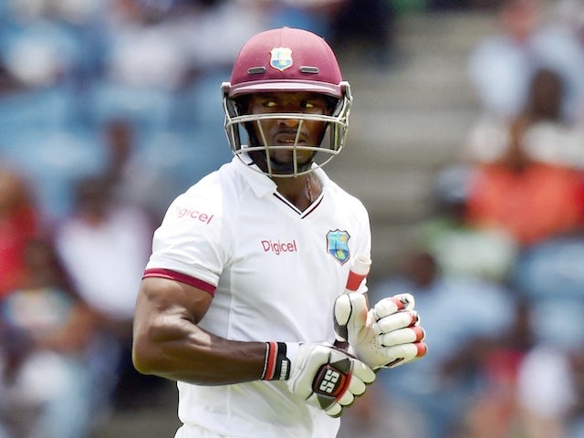 West Indies batsman Devon Smith leaves the field after being dimissed off England's bowler Chris Jordan during the second Test match between West Indies and England at the Grenada National Stadium in Saint George's on April 21, 2015