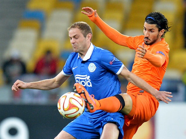 FC Dnipro's Yevhen Cheberyachko vies with Brugge's Lior Refaelov during the UEFA Europa League second leg quarter-final football match between FC Dnipro Dnipropetrovsk and Club Brugge KV in Kiev on April 23, 2015