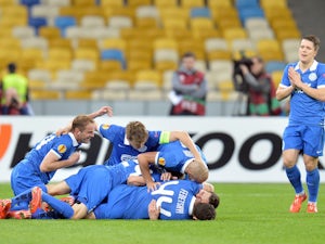 FC Dnipro's players celebrate after scoring a goal during the UEFA Europa League second leg quarter-final football match between FC Dnipro Dnipropetrovsk and Club Brugge KV in Kiev on April 23, 2015