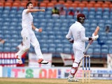 England's bowler James Anderson leaps into the air to celebrate dismissing West Indies batsman Marlon Samuels during the final day of the second Test cricket match between the West Indies and England at the Grenada National Cricket Stadium in Saint George
