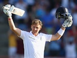 Joe Root of England celebrates reaching his century during day three of the 2nd Test match between West Indies and England at the National Cricket Stadium in St George's on April 23, 2015 