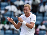 England's bowler Stuart Broad celebrates dismissing West Indies batsman Jason Holder during day two of the second Test match between West Indies and England at the Grenada National Stadium in Saint George's on April 22, 2015