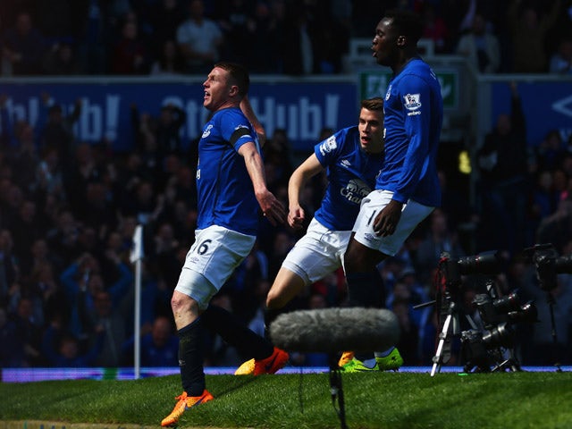 James McCarthy of Everton (16) celebrates with Seamus Coleman and Romelu Lukaku as he scores their first goal during the Barclays Premier League match between Everton and Manchester United at Goodison Park on April 26, 2015