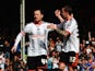 Ross McCormack of Fulham celebrates with team mate Sean Kavanagh after scoring his sides second goal from the penalty spot during the Sky Bet Championship match between Fulham and Middlesbrough at Craven Cottage on April 25, 2015