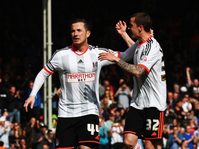 Ross McCormack of Fulham celebrates with team mate Sean Kavanagh after scoring his sides second goal from the penalty spot during the Sky Bet Championship match between Fulham and Middlesbrough at Craven Cottage on April 25, 2015