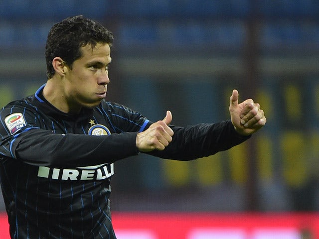 Inter Milan's midfielder from Brazil Hernanes celebrates after scoring during the Italian Serie A football match Inter Milan vs Roma on April 25, 2015