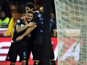 Inter Milan's forward from Argentina Mauro Icardi celebrates after scoring during the Italian Serie A football match Inter Milan vs Roma on April 25, 2015